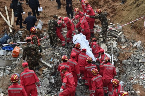 A trapped person is found dead at the site of landslide at an industrial park in Shenzhen, south China's Guangdong Province, Dec. 23, 2015. There was one survivor pulled out alive while the other found dead at the landslide site by far, but still 75 missing in the landslide. (Xinhua/Liang Xu) A trapped person is found dead at the site of landslide at an industrial park in Shenzhen, south China's Guangdong Province, Dec. 23, 2015. There was one survivor pulled out alive while the other found dead at the landslide site by far, but still 75 missing in the landslide. (Xinhua/Liang Xu)