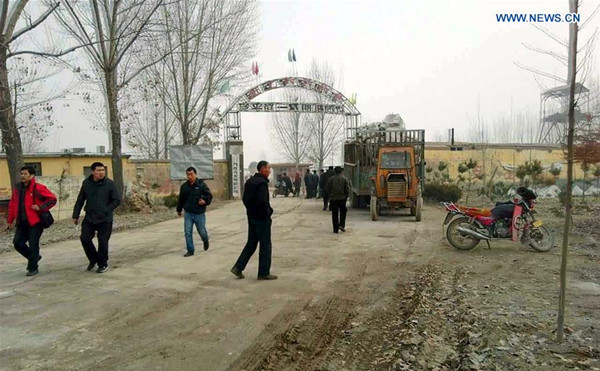 People are seen outside the entrance of a gypsum mine in Pingyi County, east China's Shandong Province, Dec. 25, 2015. A gypsum mine collapsed in Pingyi Friday, burying many people, sources with the local government said, without giving further details. A rescue operation has been launched. (Xinhua) People are seen outside the entrance of a gypsum mine in Pingyi County, east China's Shandong Province, Dec. 25, 2015. A gypsum mine collapsed in Pingyi Friday, burying many people, sources with the local government said, without giving further details. A rescue operation has been launched. (Xinhua)