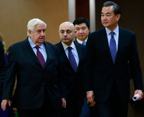 Foreign Minister Wang Yi (right) joins his visiting Syrian counterpart Walid al-Moallem for a media briefing in Beijing on Thursday. Foreign Minister Wang Yi (right) joins his visiting Syrian counterpart Walid al-Moallem for a media briefing in Beijing on Thursday.