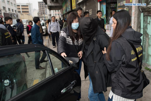 Policewomen escort a drug dealer suspect in Macao, south China, on Dec. 27, 2015. Macao police arrested a Turkish drug trafficking man suspect and two suspects from Hong Kong, seizing 9.8 kg of cocaine. (Xinhua/Cheong Kam Ka) Policewomen escort a drug dealer suspect in Macao, south China, on Dec. 27, 2015. Macao police arrested a Turkish drug trafficking man suspect and two suspects from Hong Kong, seizing 9.8 kg of cocaine. (Xinhua/Cheong Kam Ka)