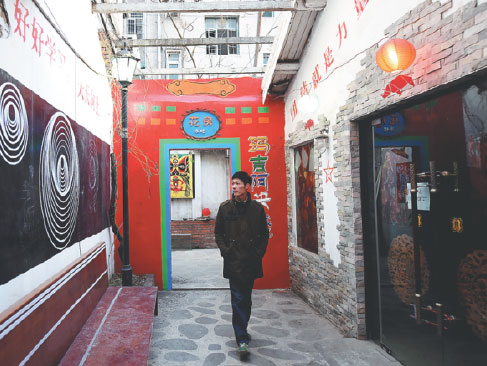 A man walks past a bar in the neighborhood which was transformed from a shabby village on Shuguang Road in Hefei, Anhui province. A man walks past a bar in the neighborhood which was transformed from a shabby village on Shuguang Road in Hefei, Anhui province.