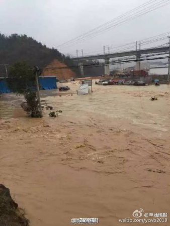 Water flooding a nearby village. (Photo/Sina Weibo) Water flooding a nearby village. (Photo/Sina Weibo)