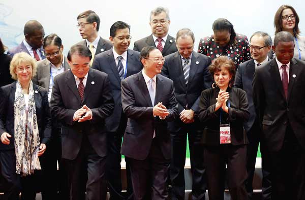 State Councilor Yang Jiechi (front, third from left) joins other officials from G20 economies at the First G20 Sherpa Meeting in Beijing on Thursday. The three-day gathering forms part of the runup to the G20 Summit in Hangzhou, Zhejiang province. (Photo: China Daily/Feng Yongbin)