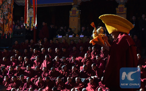 A Buddhist prepares to serve tea to Panchen during the 20th anniversary of the enthronement of Bainqen Erdini Qoigyijabu, the 11th Panchen Lama, one of the two most revered living Buddhas in Tibetan Buddhism, in Tashilhunpo Monastery in Xigaze, southwest China's Tibet Autonomous Region, Dec. 8, 2015. (Xinhua file photo/Chogo) A Buddhist prepares to serve tea to Panchen during the 20th anniversary of the enthronement of Bainqen Erdini Qoigyijabu, the 11th Panchen Lama, one of the two most revered living Buddhas in Tibetan Buddhism, in Tashilhunpo Monastery in Xigaze, southwest China's Tibet Autonomous Region, Dec. 8, 2015. (Xinhua file photo/Chogo)