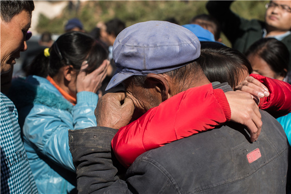 Qian Renfeng hugs her father at her home in Nantuan village, Qiaojia county, Yunnan, on Dec 22, the day after her conviction was overturned by a local court. (Photo provide to China Daily) Qian Renfeng hugs her father at her home in Nantuan village, Qiaojia county, Yunnan, on Dec 22, the day after her conviction was overturned by a local court. (Photo provide to China Daily)