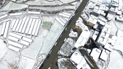 Snow-covered fields and houses are seen in Shaoguan, south China's Guangdong Province, Jan. 24, 2016. Snowfall hit some regions in Guangdong Sunday. (Photo: Xinhua/Lu Hanxin) Snow-covered fields and houses are seen in Shaoguan, south China's Guangdong Province, Jan. 24, 2016. Snowfall hit some regions in Guangdong Sunday. (Photo: Xinhua/Lu Hanxin)