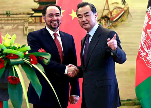 Foreign Minister Wang Yi and his Afghan counterpart Salahuddin Rabbani meet reporters after a news conference in Beijing on Tuesday. FENG YONGBIN/CHINA DAILY Foreign Minister Wang Yi and his Afghan counterpart Salahuddin Rabbani meet reporters after a news conference in Beijing on Tuesday. FENG YONGBIN/CHINA DAILY