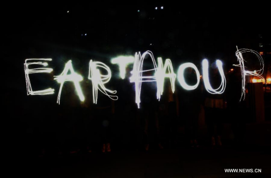 People in a community write the words of EARTH HOUR with light during the annual Earth Hour campaign in Qinhuangdao, north China's Hebei Province, March 28, 2015. (Photo: Xinhua/Yang Shirao) People in a community write the words of EARTH HOUR with light during the annual Earth Hour campaign in Qinhuangdao, north China's Hebei Province, March 28, 2015. (Photo: Xinhua/Yang Shirao)