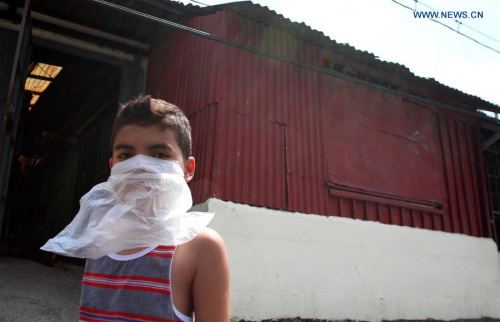A boy covers his face as an employee of the Health Ministry fumigates his house against the Aedes aegypti mosquito that can spread Zika virus at La Carpio neighborhood in San Jose, capital of Costa Rica, on Jan. 28, 2016. (Photo: Xinhua/Kent Gilbert) A boy covers his face as an employee of the Health Ministry fumigates his house against the Aedes aegypti mosquito that can spread Zika virus at La Carpio neighborhood in San Jose, capital of Costa Rica, on Jan. 28, 2016. (Photo: Xinhua/Kent Gilbert)