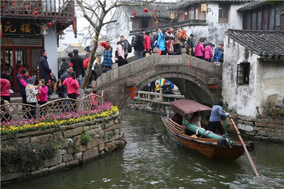 The water town of Zhouzhuang is crowded with visitors during a festival. Photos provided to China Daily The water town of Zhouzhuang is crowded with visitors during a festival. Photos provided to China Daily