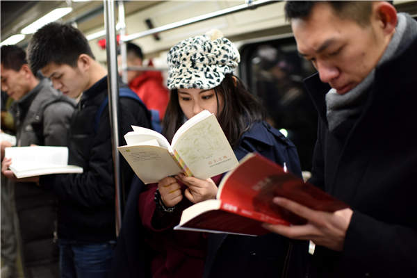 A flash-mob event in Beijing's subway aims to raise awareness of reading. Photos by He Guanxin/Provided to China Daily A flash-mob event in Beijing's subway aims to raise awareness of reading. Photos by He Guanxin/Provided to China Daily