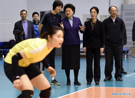 Chinese Vice Premier Liu Yandong(3rd R) exchanges views with China's national women's volleyball head coach Lang Ping(4th R) when she views the training of national women's volleyball team in Beijing, capital of China, Feb. 18, 2016. (Photo: Xinhua/Gong Lei) Chinese Vice Premier Liu Yandong(3rd R) exchanges views with China's national women's volleyball head coach Lang Ping(4th R) when she views the training of national women's volleyball team in Beijing, capital of China, Feb. 18, 2016. (Photo: Xinhua/Gong Lei)