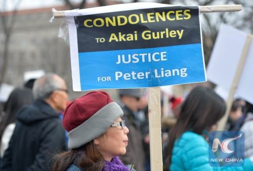 Hundreds of protesters on Saturday rallied around the Northeast Quadrant of the Washington Monument in the country's capital city, to support NYPD officer Peter Liang who was convicted of manslaughter earlier this month in the death of African-American man Akai Gurley.(Xinhua/Bao Dandan) Hundreds of protesters on Saturday rallied around the Northeast Quadrant of the Washington Monument in the country's capital city, to support NYPD officer Peter Liang who was convicted of manslaughter earlier this month in the death of African-American man Akai Gurley.(Xinhua/Bao Dandan)