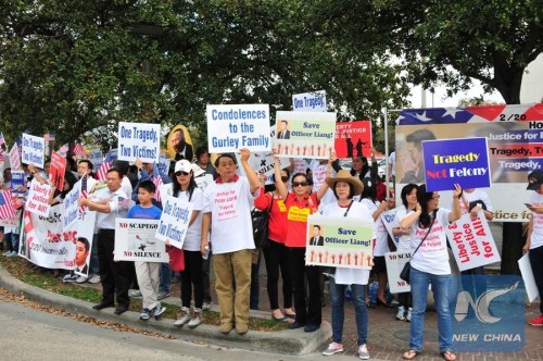 Demonstrators hold placards to demand justice for New York City police officer Peter Liang in a rally held in the city of Houston, the United States, Feb. 20, 2016. (Xinhua/Zhang Yongxing) Demonstrators hold placards to demand justice for New York City police officer Peter Liang in a rally held in the city of Houston, the United States, Feb. 20, 2016. (Xinhua/Zhang Yongxing)