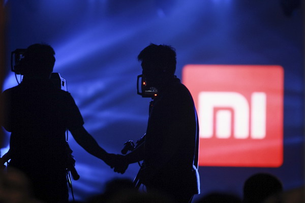 Cameramen focus on Xiaomi's new tablet at the device's unveiling on May 15, 2014 in Beijing. (Photo: China Daily/Kuang Linhua) Cameramen focus on Xiaomi's new tablet at the device's unveiling on May 15, 2014 in Beijing. (Photo: China Daily/Kuang Linhua)