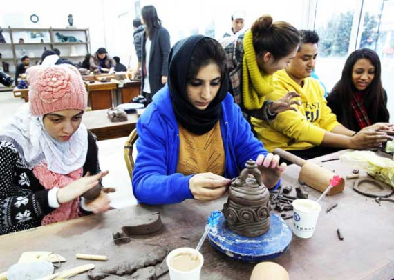 Foreign students during a pottery class at a Chinese cultural activity in Yixing, Jiangsu, in December. DING HUANXIN / FOR CHINA DAILY Foreign students during a pottery class at a Chinese cultural activity in Yixing, Jiangsu, in December. DING HUANXIN / FOR CHINA DAILY
