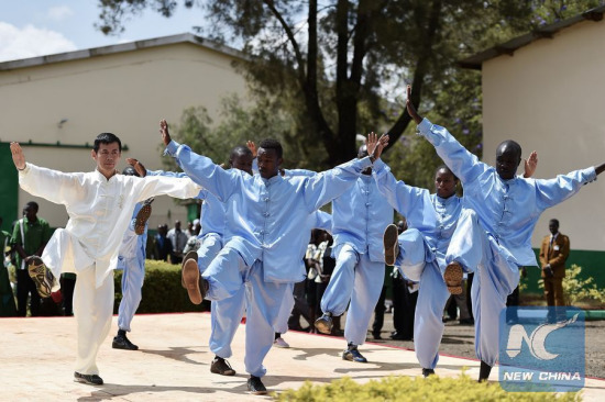 A teacher from China's Donghua University plays Tai Chi with students of Moi University during the opening ceremony of Confucius Institute at Moi University in Eldoret town, Kenya, March 30, 2015. (Photo: Xinhua/Sun Ruibo) A teacher from China's Donghua University plays Tai Chi with students of Moi University during the opening ceremony of Confucius Institute at Moi University in Eldoret town, Kenya, March 30, 2015. (Photo: Xinhua/Sun Ruibo)