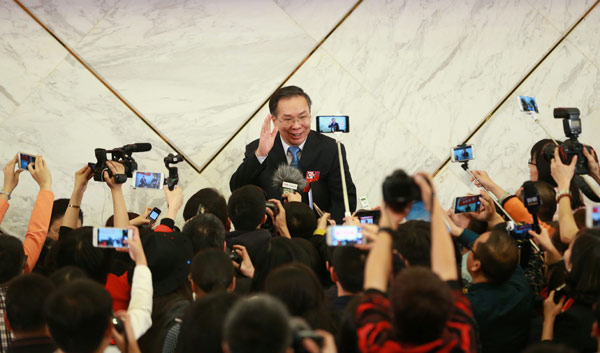 Wang Guoqing, spokesman for the annual session of the Chinese People's Political Consultative Conference National Committee, greets the media at a news briefing in Beijing on Wednesday. (Photo by Zou Hong/China Daily) Wang Guoqing, spokesman for the annual session of the Chinese People's Political Consultative Conference National Committee, greets the media at a news briefing in Beijing on Wednesday. (Photo by Zou Hong/China Daily)
