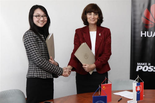 Liang Yan (L), General manager of Huawei Technologies(Slovak) and Rector of the Zilina University Tatiana Corejova shakes hands after signing the agreement of the cooperation in technology research in Zilina, Slovakia on March 2, 2016. Liang Yan (L), General manager of Huawei Technologies(Slovak) and Rector of the Zilina University Tatiana Corejova shakes hands after signing the agreement of the cooperation in technology research in Zilina, Slovakia on March 2, 2016.