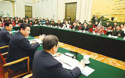 Chinese President Xi Jinping, also general secretary of the Communist Party of China (CPC) Central Committee and chairman of the Central Military Commission, reviews the work report of the State Council together with National People's Congress (NPC) deputies from Jiangxi province during the third session of the 12th NPC, in Beijing, March 6, 2015. (Photo/People's Daily Online) Chinese President Xi Jinping, also general secretary of the Communist Party of China (CPC) Central Committee and chairman of the Central Military Commission, reviews the work report of the State Council together with National People's Congress (NPC) deputies from Jiangxi province during the third session of the 12th NPC, in Beijing, March 6, 2015. (Photo/People's Daily Online)