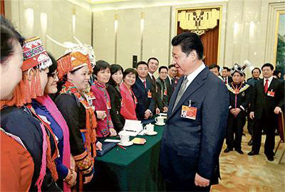 Chinese President Xi Jinping (front R), also general secretary of the Communist Party of China (CPC) Central Committee and chairman of the Central Military Commission, greets female deputies for the International Women's Day at a panel discussion with deputies to the 12th National People's Congress (NPC) from South China's Guangxi Zhuang autonomous region during the third session of the 12th NPC, in Beijing, March 8, 2015. (Photo/People's Daily Online) Chinese President Xi Jinping (front R), also general secretary of the Communist Party of China (CPC) Central Committee and chairman of the Central Military Commission, greets female deputies for the International Women's Day at a panel discussion with deputies to the 12th National People's Congress (NPC) from South China's Guangxi Zhuang autonomous region during the third session of the 12th NPC, in Beijing, March 8, 2015. (Photo/People's Daily Online)