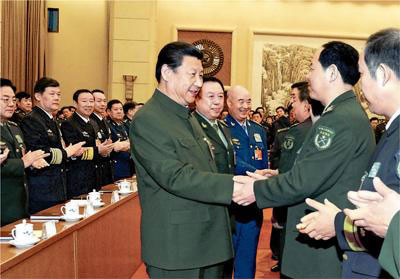 Chinese President Xi Jinping (C), also general secretary of the Communist Party of China (CPC) Central Committee and chairman of the Central Military Commission, shakes hands with deputies to the 12th National People's Congress (NPC) from the People's Liberation Army (PLA) and joins a plenary meeting of the PLA delegation during the third session of the 12th NPC in Beijing, capital of China, March 12, 2015. (Photo/People's Daily Online) Chinese President Xi Jinping (C), also general secretary of the Communist Party of China (CPC) Central Committee and chairman of the Central Military Commission, shakes hands with deputies to the 12th National People's Congress (NPC) from the People's Liberation Army (PLA) and joins a plenary meeting of the PLA delegation during the third session of the 12th NPC in Beijing, capital of China, March 12, 2015. (Photo/People's Daily Online)