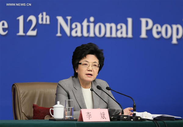 Li Bin, minister in charge of the National Health and Family Planning Commission, gives a press conference on China's two-child policy on the sidelines of the fourth session of China's 12th National People's Congress in Beijing, capital of China, March 8, 2016. (Xinhua/Chen Junqing) Li Bin, minister in charge of the National Health and Family Planning Commission, gives a press conference on China's two-child policy on the sidelines of the fourth session of China's 12th National People's Congress in Beijing, capital of China, March 8, 2016. (Xinhua/Chen Junqing)