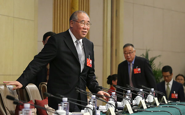 Xie Zhenhua, China's special representative on climate change, takes his seat at a news conference on the sidelines of the two sessions on Monday. KUANG LINHUA/CHINA DAILY Xie Zhenhua, China's special representative on climate change, takes his seat at a news conference on the sidelines of the two sessions on Monday. KUANG LINHUA/CHINA DAILY