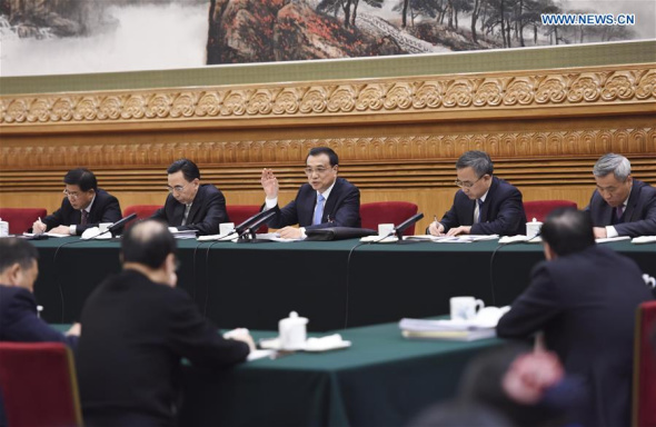 Chinese Premier Li Keqiang (C, back) joins a group deliberation of deputies from Guangdong Province to the annual session of the National People's Congress in Beijing, capital of China, March 9, 2016. (Photo: Xinhua/Li Xueren) Chinese Premier Li Keqiang (C, back) joins a group deliberation of deputies from Guangdong Province to the annual session of the National People's Congress in Beijing, capital of China, March 9, 2016. (Photo: Xinhua/Li Xueren)