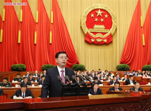 Zhang Dejiang, chairman of the Standing Committee of China's National People's Congress (NPC), delivers a report on the work of the NPC Standing Committee during the second plenary meeting of the fourth session of the 12th NPC at the Great Hall of the People in Beijing, capital of China, March 9, 2016. (Photo: Xinhua/Yao Dawei) Zhang Dejiang, chairman of the Standing Committee of China's National People's Congress (NPC), delivers a report on the work of the NPC Standing Committee during the second plenary meeting of the fourth session of the 12th NPC at the Great Hall of the People in Beijing, capital of China, March 9, 2016. (Photo: Xinhua/Yao Dawei)