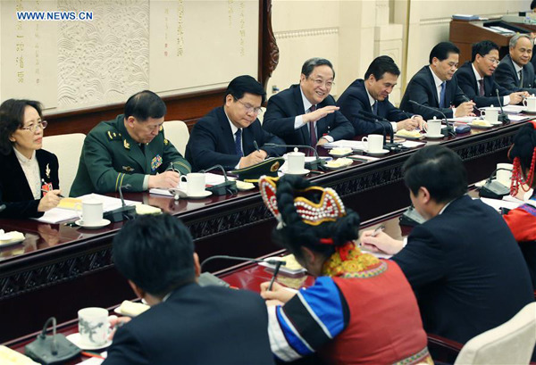 Yu Zhengsheng (4th L, back), chairman of the National Committee of the Chinese People's Political Consultative Conference, joins a group deliberation of deputies from Yunnan Province to the annual session of the National People's Congress in Beijing, capital of China, March 11, 2016. (Xinhua/Yao Dawei) Yu Zhengsheng (4th L, back), chairman of the National Committee of the Chinese People's Political Consultative Conference, joins a group deliberation of deputies from Yunnan Province to the annual session of the National People's Congress in Beijing, capital of China, March 11, 2016. (Xinhua/Yao Dawei)