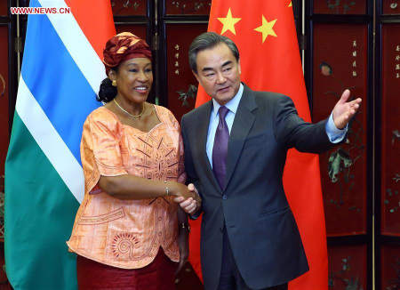 Chinese Foreign Minister Wang Yi (R) holds talks with his Gambian counterpart Neneh MacDouall Gaye in Beijing, capital of China, March 17, 2016. (Xinhua/Ding Haitao) Chinese Foreign Minister Wang Yi (R) holds talks with his Gambian counterpart Neneh MacDouall Gaye in Beijing, capital of China, March 17, 2016. (Xinhua/Ding Haitao)