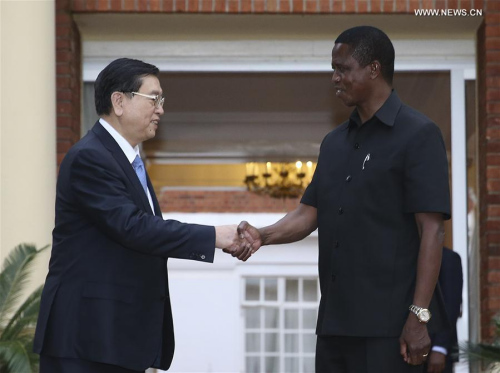 Zhang Dejiang (L), chairman of the Standing Committee of China's National People's Congress (NPC), shakes hands with Zambian President Edgar Lungu in Lusaka, capital of Zambia, March 19, 2016. Zhang paid an official goodwill visit to Zambia on March 18-22. (Xinhua/Ma Zhancheng) Zhang Dejiang (L), chairman of the Standing Committee of China's National People's Congress (NPC), shakes hands with Zambian President Edgar Lungu in Lusaka, capital of Zambia, March 19, 2016. Zhang paid an official goodwill visit to Zambia on March 18-22. (Xinhua/Ma Zhancheng)