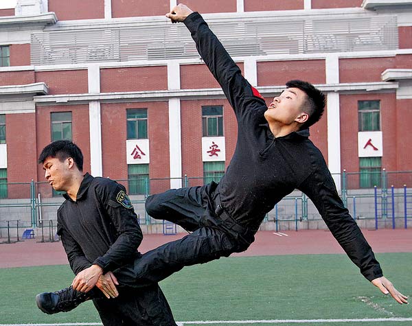 Students majoring in counterterrorism at the People's Public Security University of China attend a physical combat training session. Zhang Wei / China Daily Students majoring in counterterrorism at the People's Public Security University of China attend a physical combat training session. Zhang Wei / China Daily