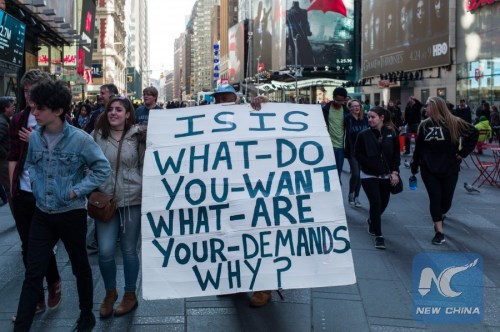 A man holds a sign as he protests ISIS at New York's Time Square, the United States, March 22, 2016. The Islamic State (IS) has claimed responsibility for Tuesday's terror attacks in Belgian capital of Brussels, which killed at least 34 people and injured more than 100. (Xinhua/Li Muzi) A man holds a sign as he protests ISIS at New York's Time Square, the United States, March 22, 2016. The Islamic State (IS) has claimed responsibility for Tuesday's terror attacks in Belgian capital of Brussels, which killed at least 34 people and injured more than 100. (Xinhua/Li Muzi)
