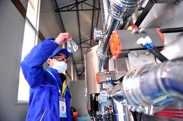 A staff member from a drinking water company tests water quality in Lhasa. Liu Kun / Xinhua A staff member from a drinking water company tests water quality in Lhasa. Liu Kun / Xinhua