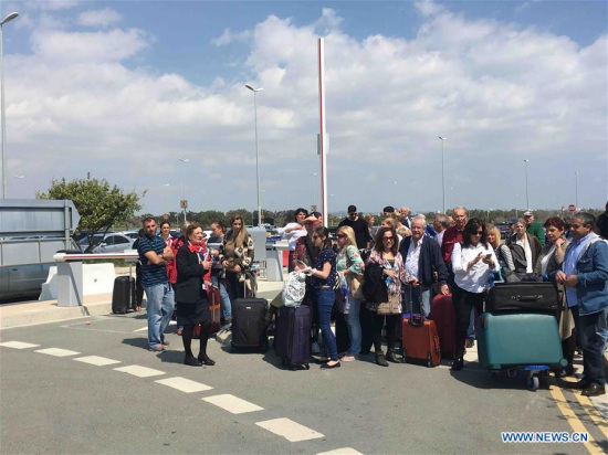 Passengers wait for a bus to Paphos at the Larnaca airport in Larnaca, Cyprus, March 29, 2016. The women and children on a hijacked Egyptian plane have been released after it landed in Larnaca, Cyprus, Cypriot authorities said Tuesday. Larnaca airport has been closed and arriving planes are being redirected to Paphos in western Cyprus. (Photo: Xinhua/Zhang Zhang) Passengers wait for a bus to Paphos at the Larnaca airport in Larnaca, Cyprus, March 29, 2016. The women and children on a hijacked Egyptian plane have been released after it landed in Larnaca, Cyprus, Cypriot authorities said Tuesday. Larnaca airport has been closed and arriving planes are being redirected to Paphos in western Cyprus. (Photo: Xinhua/Zhang Zhang)