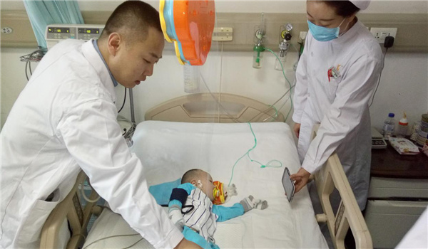 The boy after heart surgery. (Photo/www.chinajilin.com.cn) The boy after heart surgery. (Photo/www.chinajilin.com.cn)