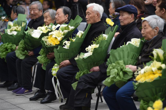 Survivors of Nanjing Massacre attend a ceremony to mourn the Nanjing Massacre victims at the Memorial Hall of the Victims in Nanjing Massacre by Japanese Invaders on the Qingming Festival in Nanjing, capital of east China's Jiangsu Province, April 4, 2016. (Photo: Xinhua/Han Yuqing) Survivors of Nanjing Massacre attend a ceremony to mourn the Nanjing Massacre victims at the Memorial Hall of the Victims in Nanjing Massacre by Japanese Invaders on the Qingming Festival in Nanjing, capital of east China's Jiangsu Province, April 4, 2016. (Photo: Xinhua/Han Yuqing)