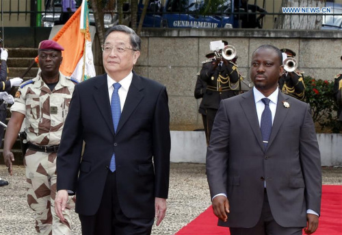 Yu Zhengsheng (L front), chairman of the National Committee of the Chinese People's Political Consultative Conference, attends a welcoming ceremony before talks with Cote d'Ivoire's Parliament Speaker Guillaume Soro in Abidjan, Cote d'Ivoire, April 14, 2016. (Photo: Xinhua/Ju Peng) Yu Zhengsheng (L front), chairman of the National Committee of the Chinese People's Political Consultative Conference, attends a welcoming ceremony before talks with Cote d'Ivoire's Parliament Speaker Guillaume Soro in Abidjan, Cote d'Ivoire, April 14, 2016. (Photo: Xinhua/Ju Peng)