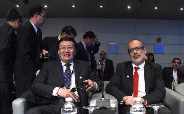 Finance Minister Lou Jiwei (left) with fellow participants at the inaugural Global Infrastructure Forum in Washington on Saturday. Yin Bogu / Xinhua Finance Minister Lou Jiwei (left) with fellow participants at the inaugural Global Infrastructure Forum in Washington on Saturday. Yin Bogu / Xinhua