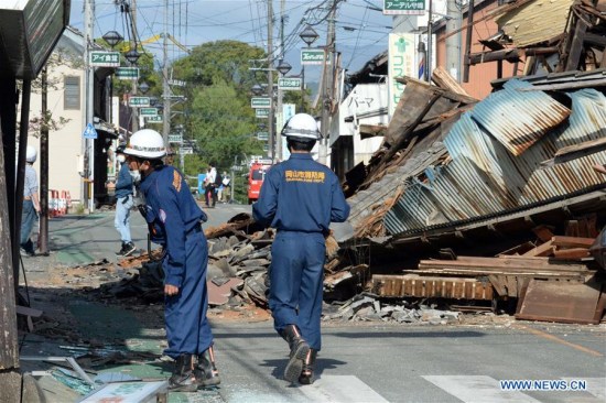 Firefighters check the buildings in the earthquake rocked Mashiki in Kumamoto prefecture, Japan, April 17, 2016. A powerful magnitude-7.3 earthquake struck the island of Kyushu in southwestern Japan early Saturday just a day after a sizable foreshock hit the region, with the number of fatalities now standing at 41 according to the latest figures on Sunday. (Xinhua/Ma Ping) Firefighters check the buildings in the earthquake rocked Mashiki in Kumamoto prefecture, Japan, April 17, 2016. A powerful magnitude-7.3 earthquake struck the island of Kyushu in southwestern Japan early Saturday just a day after a sizable foreshock hit the region, with the number of fatalities now standing at 41 according to the latest figures on Sunday. (Xinhua/Ma Ping)