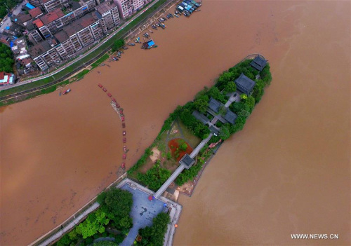Photo taken on April 18, 2016 shows the Shigu Academy besieged by rising water on the Xiangjiang River in Hengyang City, central China's Hunan Province. Heavy rain and hailstorm have battered the province over the past few days, leaving four people killed and about 387,000 people affected. (Photo: Xinhua/Peng Bin) Photo taken on April 18, 2016 shows the Shigu Academy besieged by rising water on the Xiangjiang River in Hengyang City, central China's Hunan Province. Heavy rain and hailstorm have battered the province over the past few days, leaving four people killed and about 387,000 people affected. (Photo: Xinhua/Peng Bin)