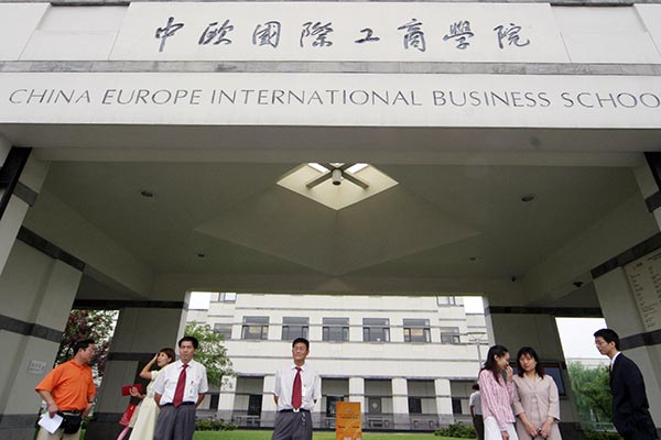 People at the entrance of the China Europe International Business School. HE ZI / FOR CHINA DAILY People at the entrance of the China Europe International Business School. HE ZI / FOR CHINA DAILY