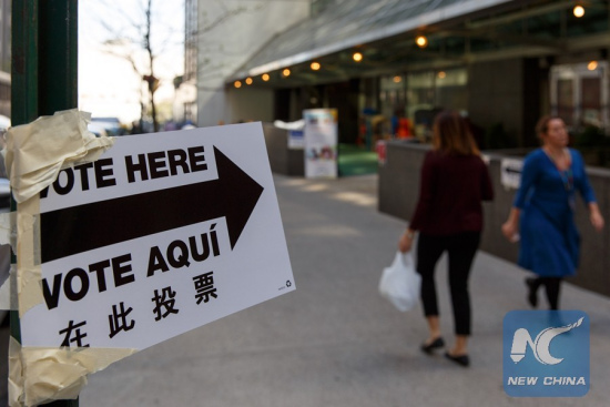 A sign reads Vote Here is seen outside a polling station in Manhattan, New York, April 19, 2016. New York's presidential primary kicked off on Tuesday. (Xinhua/Li Muzi) A sign reads Vote Here is seen outside a polling station in Manhattan, New York, April 19, 2016. New York's presidential primary kicked off on Tuesday. (Xinhua/Li Muzi)