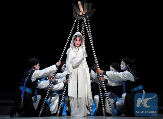 Actors perform traditional Kunqu Opera Peony Pavilion during the 10th China Art Festival in Jinan, capital of east China's Shandong Province, Oct. 18, 2013. Peony Pavilion, created by ancient Chinese playwriter Tang Xianzu (1550-1616), tells a love story between Du Liniang and Liu Mengmei, embodying young people's pursuit of love and freedom. (Photo: Xinhua/Xu Suhui) Actors perform traditional Kunqu Opera Peony Pavilion during the 10th China Art Festival in Jinan, capital of east China's Shandong Province, Oct. 18, 2013. Peony Pavilion, created by ancient Chinese playwriter Tang Xianzu (1550-1616), tells a love story between Du Liniang and Liu Mengmei, embodying young people's pursuit of love and freedom. (Photo: Xinhua/Xu Suhui)