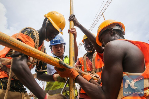 Chinese engineer Zhang Qingchun (2nd L) works with his Kenyan colleagues at a constructing site of the Mombassa West Station under a standard gauge railway (SGR) project, in Mombassa, Kenya, on April 9, 2016. (Photo: Xinhua/Pan Siwei) Chinese engineer Zhang Qingchun (2nd L) works with his Kenyan colleagues at a constructing site of the Mombassa West Station under a standard gauge railway (SGR) project, in Mombassa, Kenya, on April 9, 2016. (Photo: Xinhua/Pan Siwei)