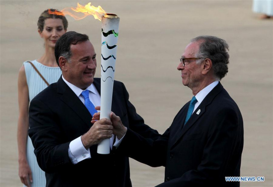 Carlos Nuzman(R), the President of the Organizing Committee for the RIO 2016 Olympic Games, receives the torch from Spyros Capralos, the President of HOC (Hellenic Olympic Committee), during the handover ceremony at Panathenaic Stadium in Athens, April 27, 2016. (Photo: Xinhua/Marios Lolos) Carlos Nuzman(R), the President of the Organizing Committee for the RIO 2016 Olympic Games, receives the torch from Spyros Capralos, the President of HOC (Hellenic Olympic Committee), during the handover ceremony at Panathenaic Stadium in Athens, April 27, 2016. (Photo: Xinhua/Marios Lolos)