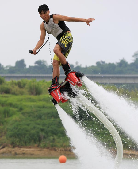 A man seen flyboarding, one of China's popular water sports, in Nanning, Guangxi Zhuang autonomous region. TAN KAIXING / FOR CHINA DAILY A man seen flyboarding, one of China's popular water sports, in Nanning, Guangxi Zhuang autonomous region. TAN KAIXING / FOR CHINA DAILY