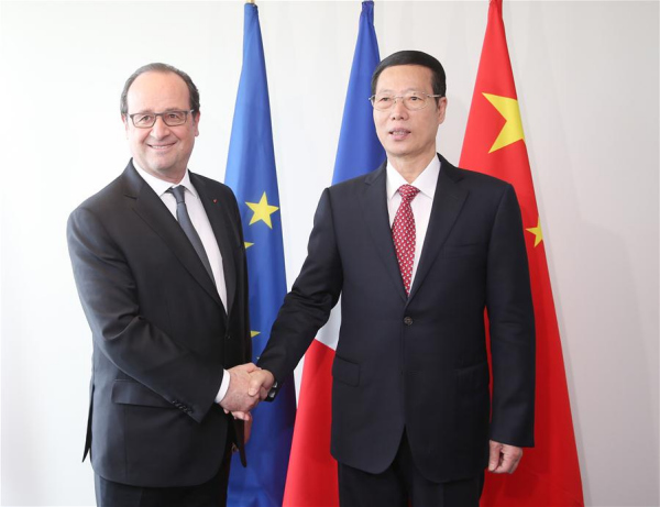 Zhang Gaoli (R), Chinese vice premier and special envoy of President Xi Jinping, meets with French President Francois Hollande on the sidelines of the opening ceremony of the High-Level Event for the Signature of the Paris Agreement at the United Nations headquarters in New York April 22, 2016. (Xinhua/Yao Dawei) Zhang Gaoli (R), Chinese vice premier and special envoy of President Xi Jinping, meets with French President Francois Hollande on the sidelines of the opening ceremony of the High-Level Event for the Signature of the Paris Agreement at the United Nations headquarters in New York April 22, 2016. (Xinhua/Yao Dawei)